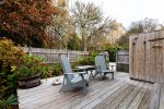 Deck with fully enclosed outdoor shower off of main floor king bedroom